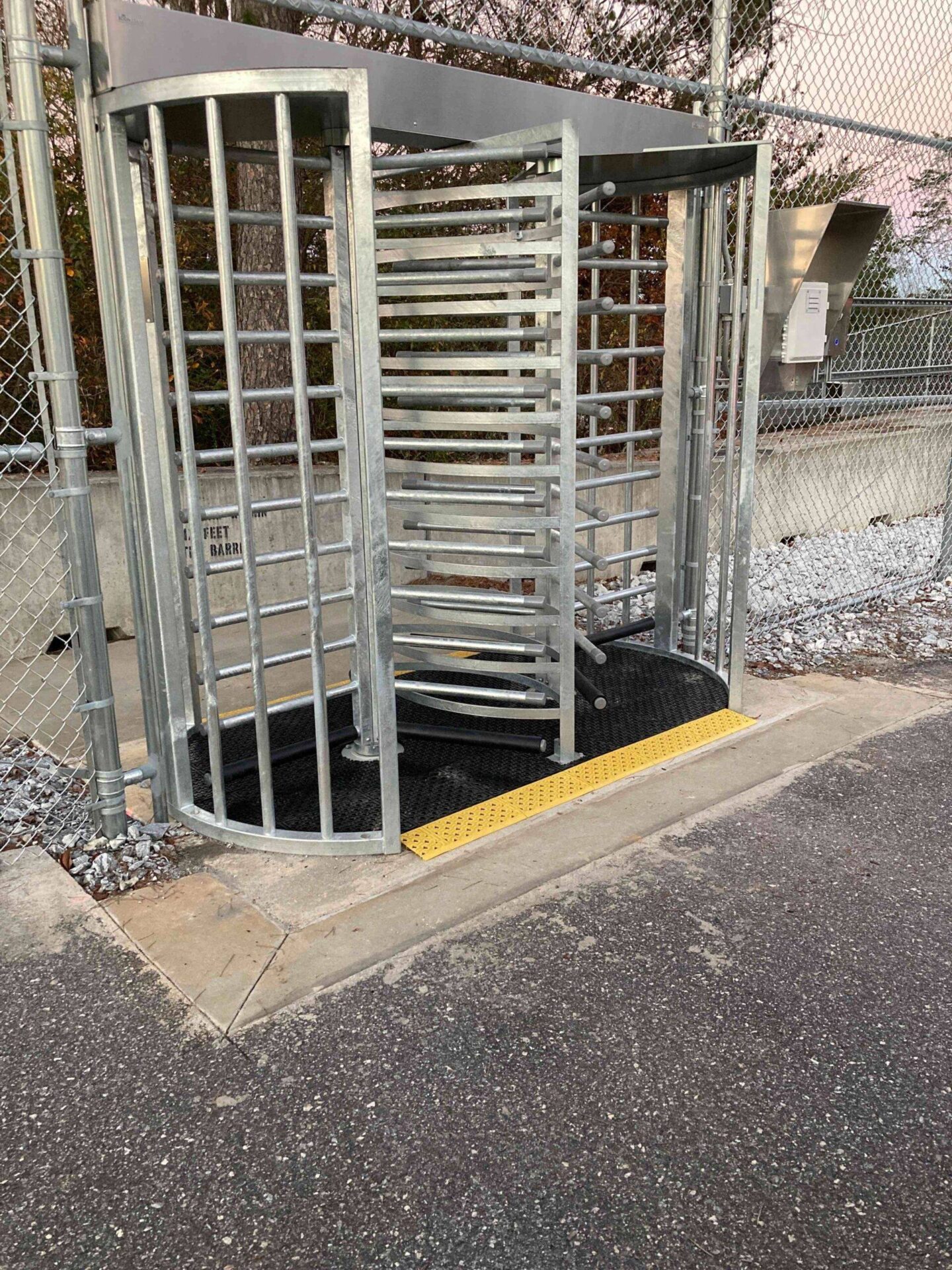Full-height turnstile at a secured pedestrian entry