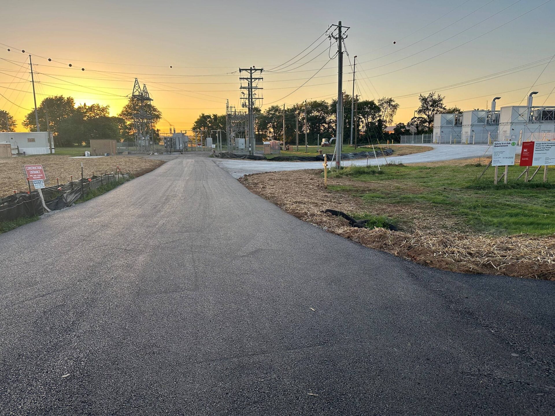 Freshly paved asphalt access road for transportation infrastructure