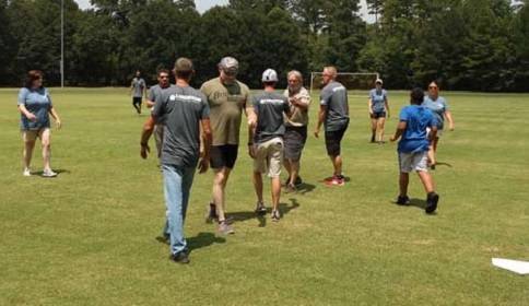 Langston Construction team during an outdoor company event in branded shirts