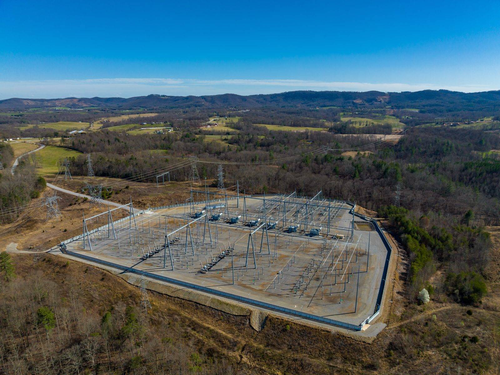 Aerial view of a fenced electric substation