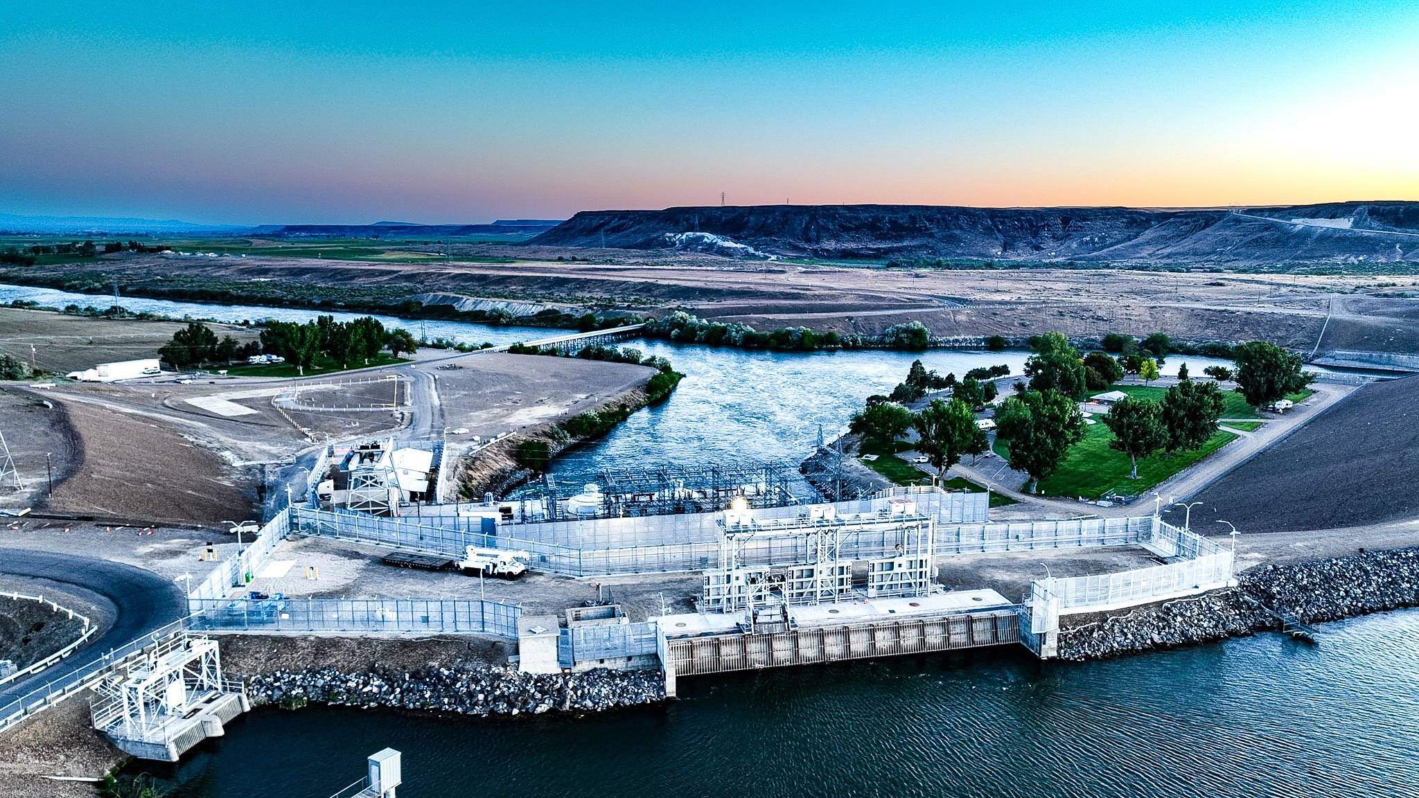 Aerial view of a hydroelectric powerhouse on a river