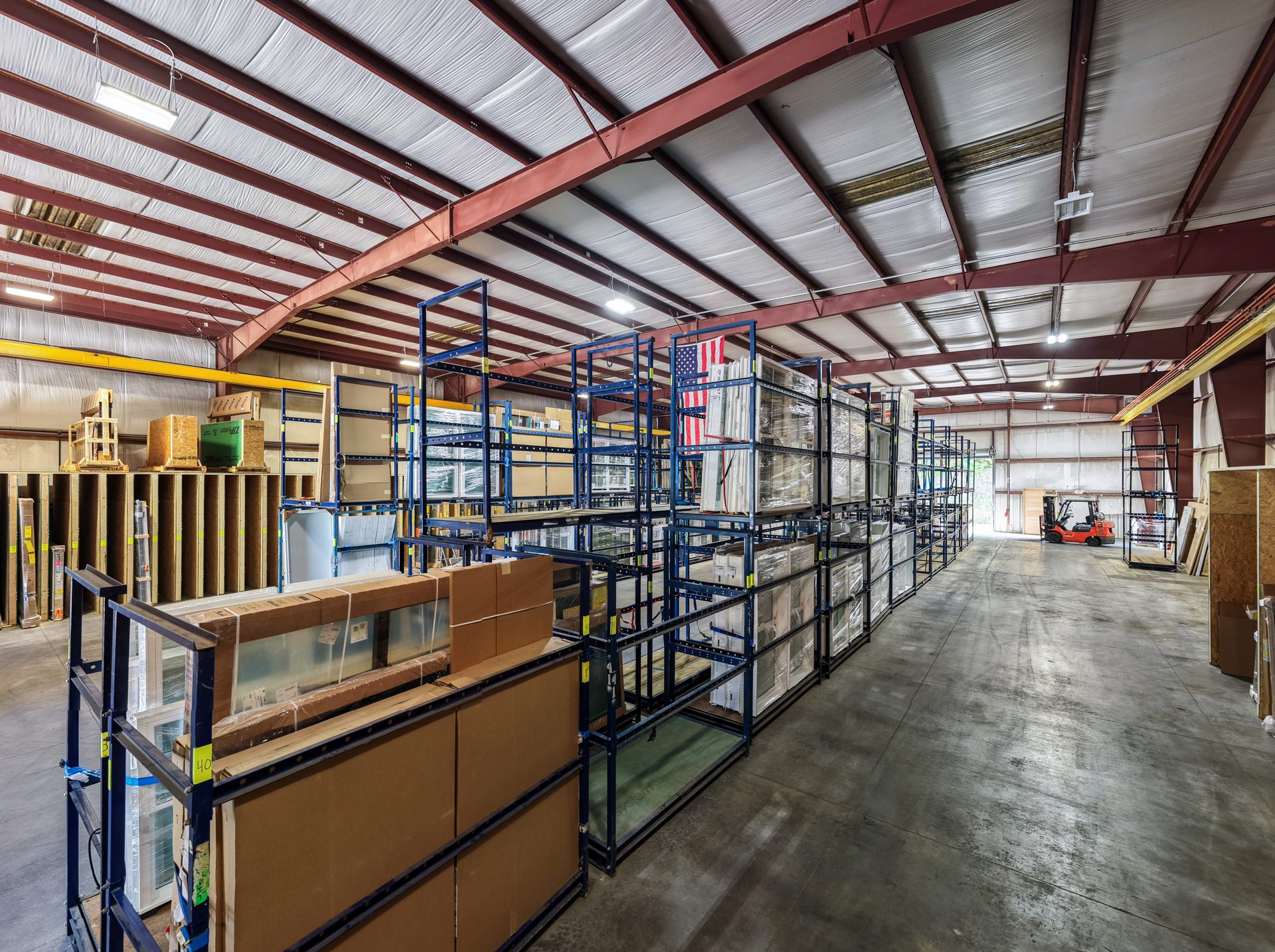 Door shop warehouse with storage racks and LED lighting at GBS Fletcher