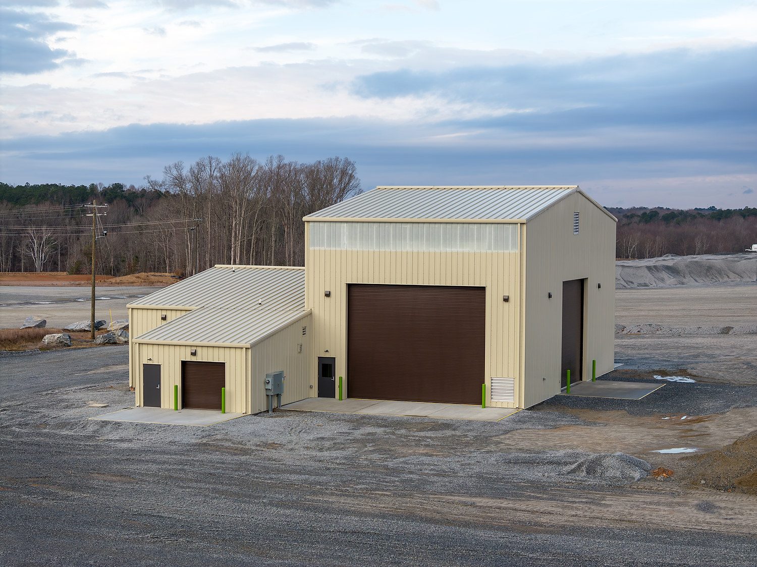 Luck Stone operations facility exterior with concrete aprons and gravel hardscape